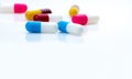 Selective focus on blue-white antibiotic capsule pills on white background. Prescription drugs. Colorful capsule pills. Antibiotic