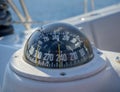 Selective focus of a boat compass on a sailboat Royalty Free Stock Photo