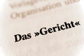 Selective focus from the book page of the words 'Das Gericht' translated as The court