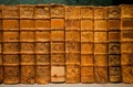 Selective focus on bookshelf with antique leather covers, printed at 18th century. Old books of a library or bookstore Royalty Free Stock Photo