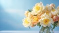 Selective focus on a bouquet of fresh tender yellow peonies in a glass vase