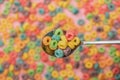 Focus of bright colorful breakfast cereal in spoon Royalty Free Stock Photo