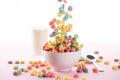 Selective focus of bright multicolored breakfast cereal falling in bowl near milk and spoon Royalty Free Stock Photo