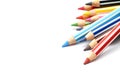 Selective focus of bunch of color pencils with stripe, white background.