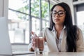 Selective focus of businesswoman reaching glass