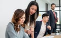 Selective focus businesswomen wearing formal clothes, using laptop, seriously analyzing, talking, discussing and brainstorming