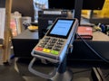 Selective focus on a card reader terminal inside a local cafe Royalty Free Stock Photo