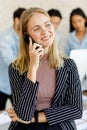 Selective focus on Caucasian businesswomen Talking on the phone to meet with business people Ethnic diversity in the office Royalty Free Stock Photo