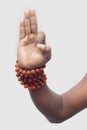 A hand showing `gyan mudra` a special type of yoga.