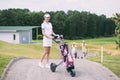 selective focus of cheerful female golf player in cap and white polo with golf gear Royalty Free Stock Photo