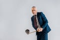 Selective focus of cheerful mature businessman holding golf club while playing isolated Royalty Free Stock Photo