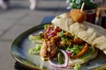 Chicken sandwich on the plate and outdoor table Royalty Free Stock Photo