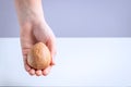 Selective focus on a child hand with avocado seed.