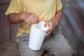 selective focus, child's hand stained with nectar, red and white, and holding a white paper cup Child care Royalty Free Stock Photo