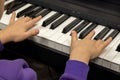 Selective focus on children& x27;s fingers and piano keys for playing the piano. Musical instrument for concert or music Royalty Free Stock Photo