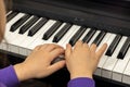 Selective focus on children& x27;s fingers and piano keys for playing the piano. Musical instrument for concert or music Royalty Free Stock Photo