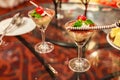 Selective focus of Chocolate creamy trifle in beautiful cocktail glasses with fresh red ripe cherry fruit and chocolate spiral sti