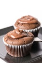 Selective focus on chocolate cup cake muffin on the black square plate Royalty Free Stock Photo