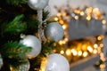 Selective focus. Christmas toy balls on the Christmas tree on the background of the kitchen, decorated for the New Year. Copy Royalty Free Stock Photo