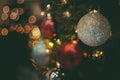 Selective focus Christmas tree with holiday silver disco balls and lights with copy space on blurred bokeh background Royalty Free Stock Photo