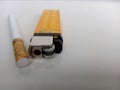 Selective Focus cigarette and gas lighter on white background Royalty Free Stock Photo