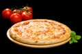 Selective focus on classic Italian fresh cheese pizza on wooden