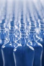 Selective focus and close up of beautiful empty blue glass bottles Royalty Free Stock Photo