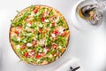 Selective focus Close up Delicious Pizza with hamon and cherry tomato slices, parmezan cheese and arugula on the wooden board on Royalty Free Stock Photo