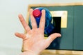 Selective focus close up hand throwing an empty plastic bottle in the recycling garbage trash or bin Royalty Free Stock Photo