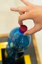 Selective focus close up hand throwing an empty plastic bottle in the recycling garbage trash or bin Royalty Free Stock Photo