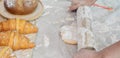 Selective focus and close up on hands using rolling pin to teach and thresh dough flour to make pie and bread for serving on table Royalty Free Stock Photo