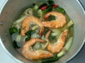 Selective focus close-up hot and spicy shrimp soup in aluminum pot