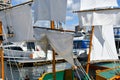 Selective focus close up of the mast and sails of a miniature sailing ship in the lake at Lake Coeur d`Alene boat show. Royalty Free Stock Photo