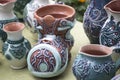 Selective focus closeup of artistic ceramic pots on the table