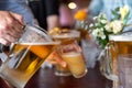 Selective focus closeup of a frosty pitcher of beer