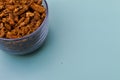 Selective focus closeup of a glass of dried carnation spices