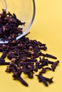 Selective focus closeup of a glass of dried carnation spices