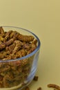 Selective focus closeup of a glass of dried carnation spices