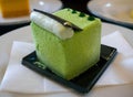 Selective focus closeup matcha green tea Japanese cheese cake on table Royalty Free Stock Photo