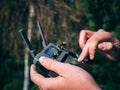 Selective focus closeup shot of a person holding black drone remote controller Royalty Free Stock Photo
