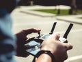 Selective focus closeup shot of a person holding black drone remote controller Royalty Free Stock Photo