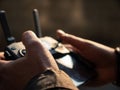 Selective focus closeup shot of a person holding black drone remote controller Royalty Free Stock Photo