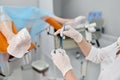 Selective focus closeup view on gynecologist hands taking biomaterial sample