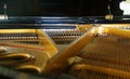 Selective focus closeup view on hammers and strings inside grand piano Royalty Free Stock Photo