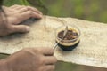 selective focus cocoa powder in a cup of black coffee in the hand of a man in the morning There is space for text Royalty Free Stock Photo