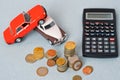 Selective focus of coins and blue toy car on white Royalty Free Stock Photo