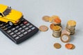 Selective focus of coins and blue toy car on white Royalty Free Stock Photo