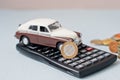 Selective focus of coins and blue toy car on white Royalty Free Stock Photo