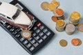 Selective focus of coins and blue toy car on white Royalty Free Stock Photo