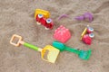 selective focus colorful children\'s toys on the sand Toy car and toy shovel concept in the technology age Children only play Royalty Free Stock Photo